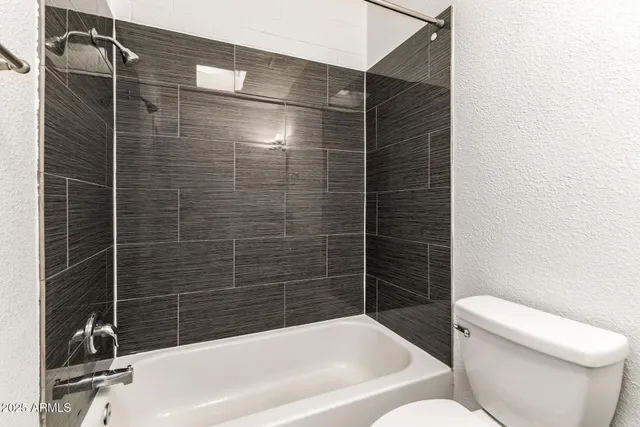 a view of a backyard with sitting area