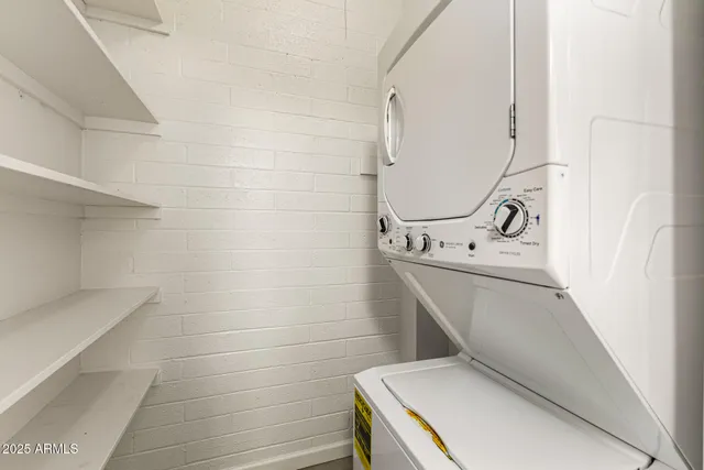 a view of a yard with plants and trees