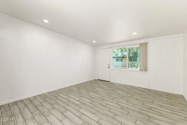 a view of an empty room and window