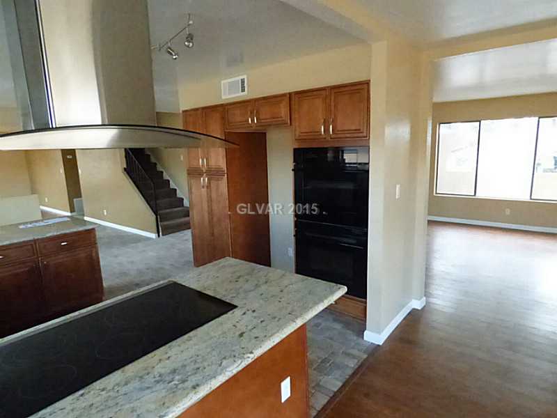 2320 Thoroughbred Road Henderson, NV 89002 - Photo 11 of 34 Property Photo. Custom Cooktop and Stainless Stand Alone Hood