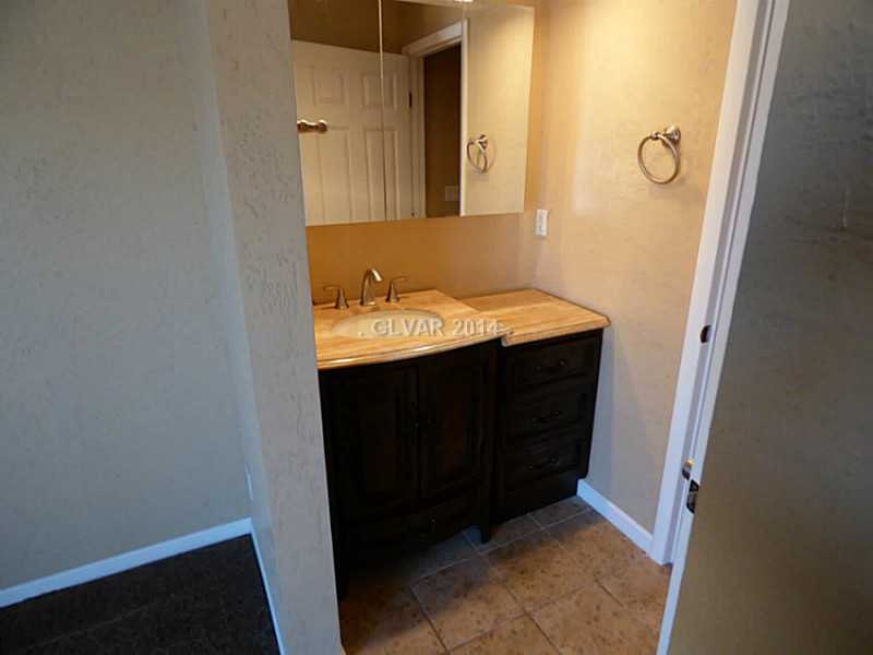 2320 Thoroughbred Road Henderson, NV 89002 - Photo 23 of 34 Property Photo. Master Custom Vanity, try turning on light , left door upper