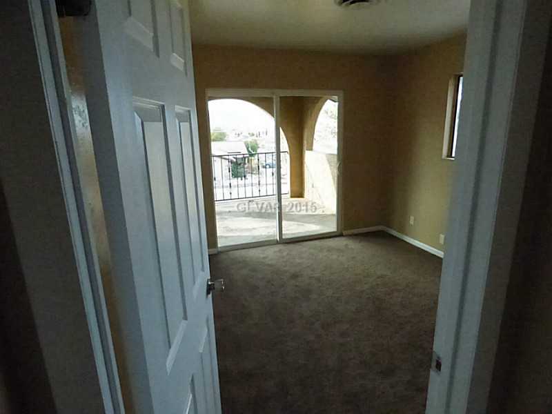 2320 Thoroughbred Road Henderson, NV 89002 - Photo 25 of 34 Property Photo. Front Bedroom with Strip view and huge balcony