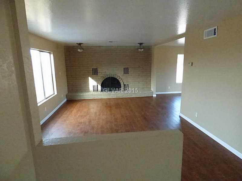 2320 Thoroughbred Road Henderson, NV 89002 - Photo 6 of 34 Property Photo. Large Living Room with wood burning fireplace