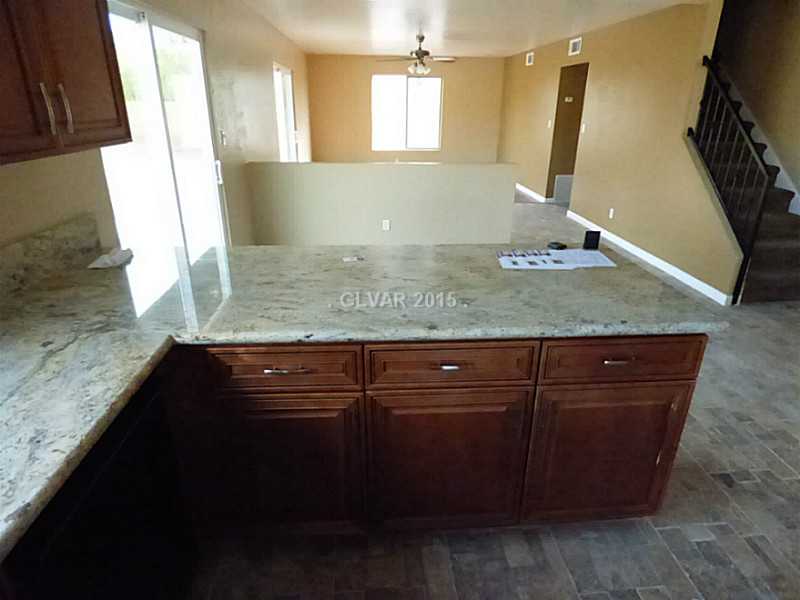 2320 Thoroughbred Road Henderson, NV 89002 - Photo 9 of 34 Property Photo. Overhang to chat while cooking