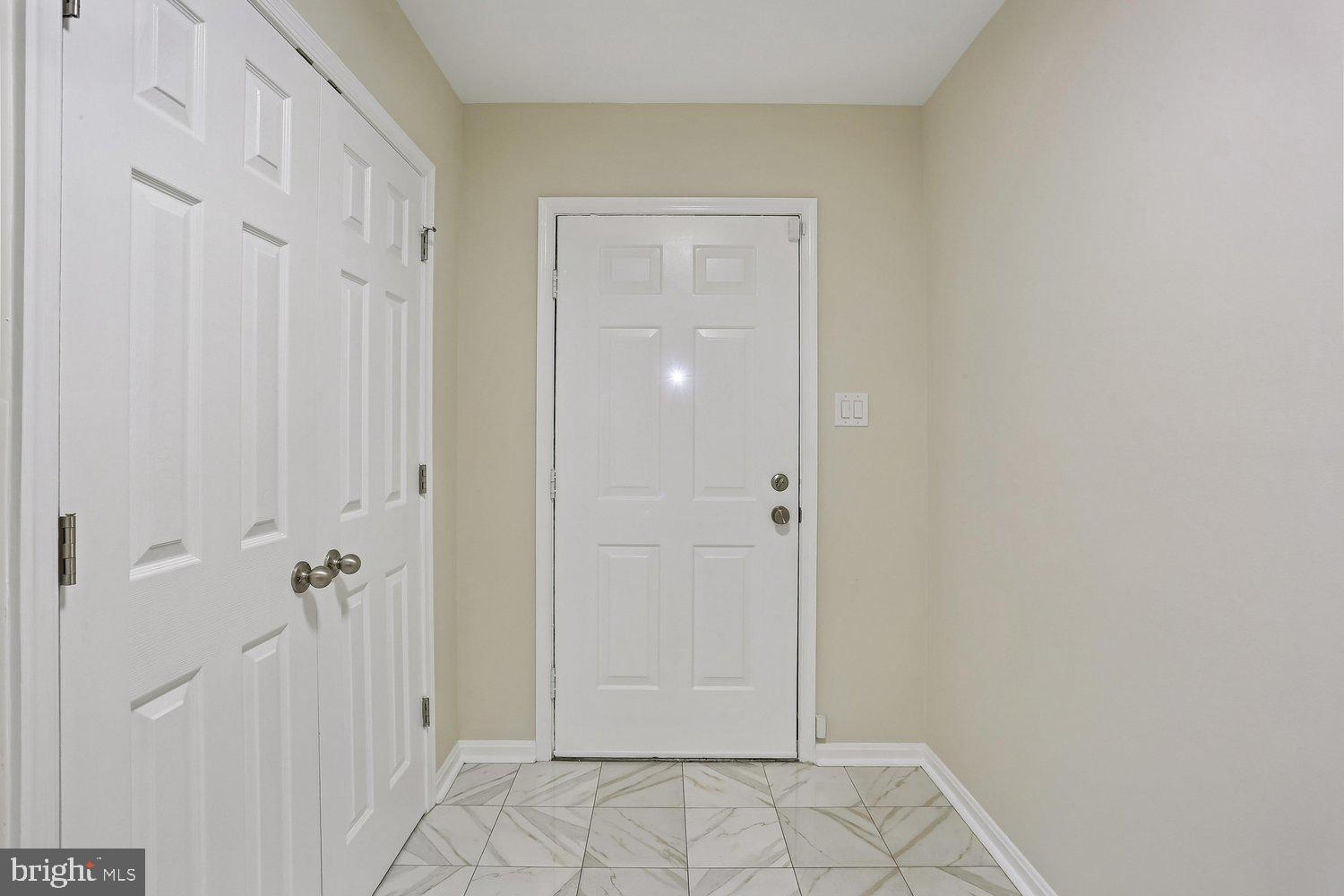 10804 Douglas Avenue Silver Spring, MD 20902 - Photo 4 of 46 Foyer entry with tile flooring