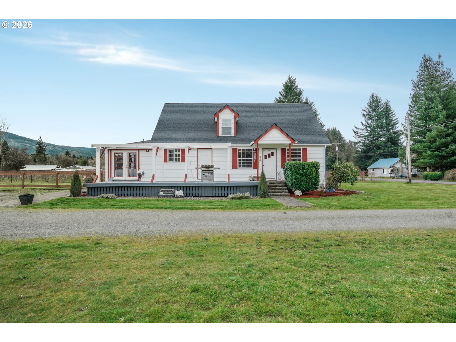 a front view of a house with a garden