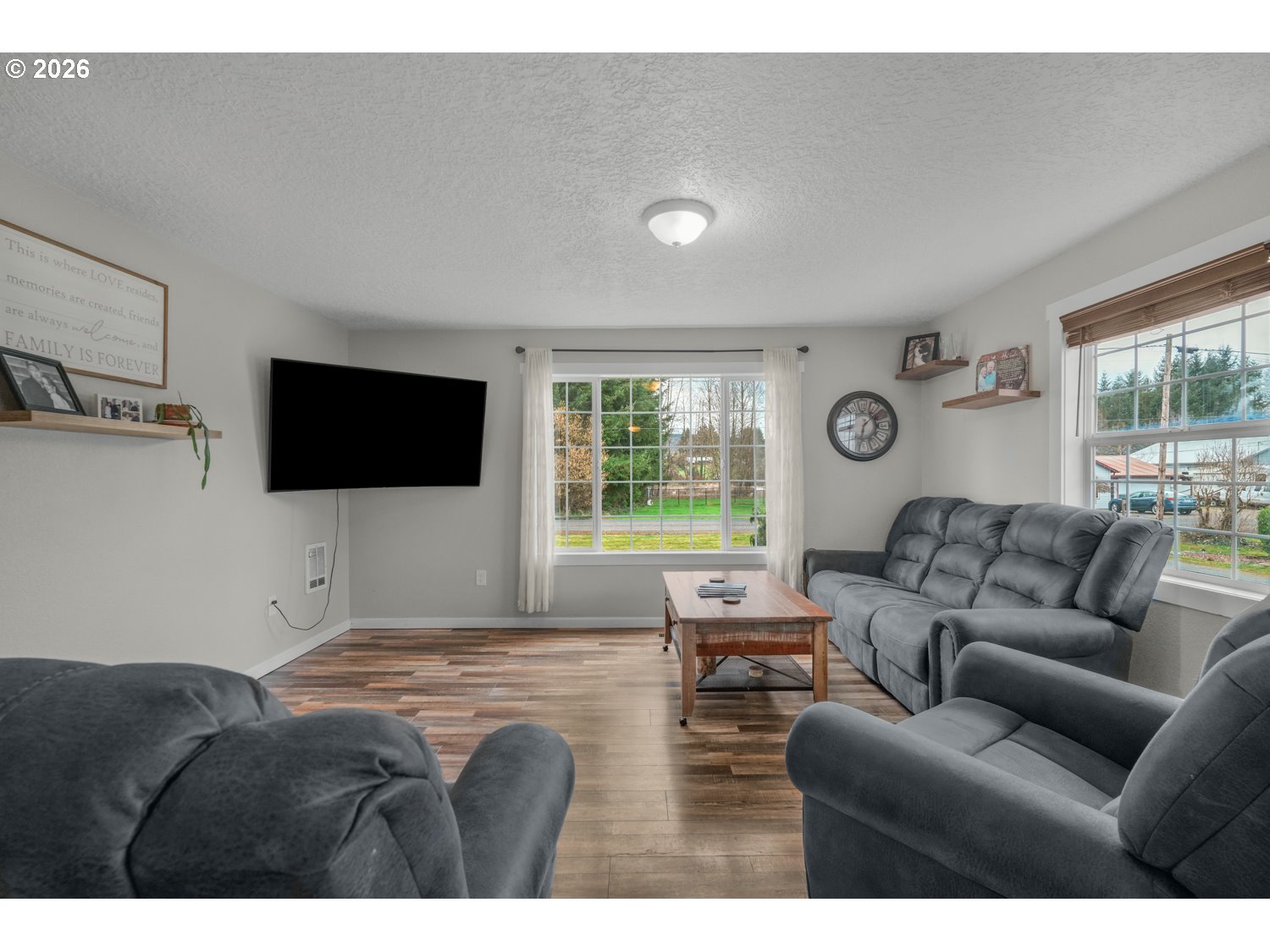 156 Damron Road Mossyrock, WA 98564 - Photo 6 of 34 a living room with furniture and a flat screen tv