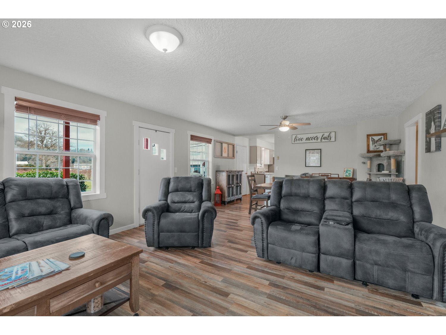 156 Damron Road Mossyrock, WA 98564 - Photo 7 of 34 a living room with furniture and a flat screen tv