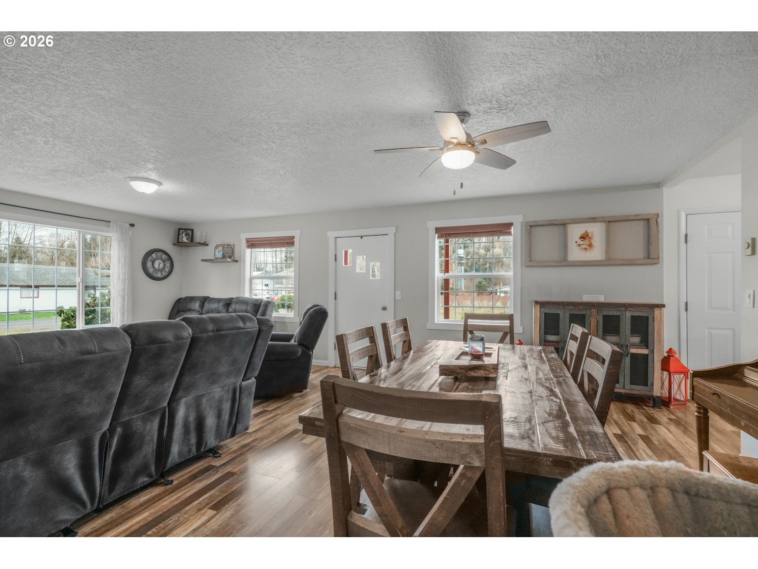 156 Damron Road Mossyrock, WA 98564 - Photo 8 of 34 a living room with furniture a ceiling fan and a window