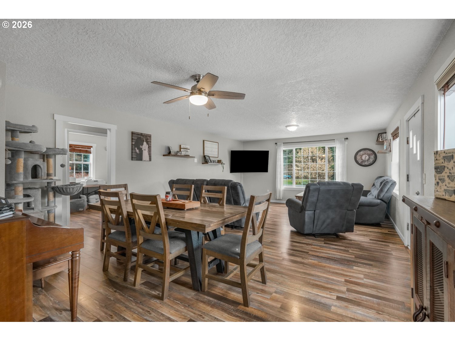 156 Damron Road Mossyrock, WA 98564 - Photo 9 of 34 a view of a dining room with furniture and wooden floor
