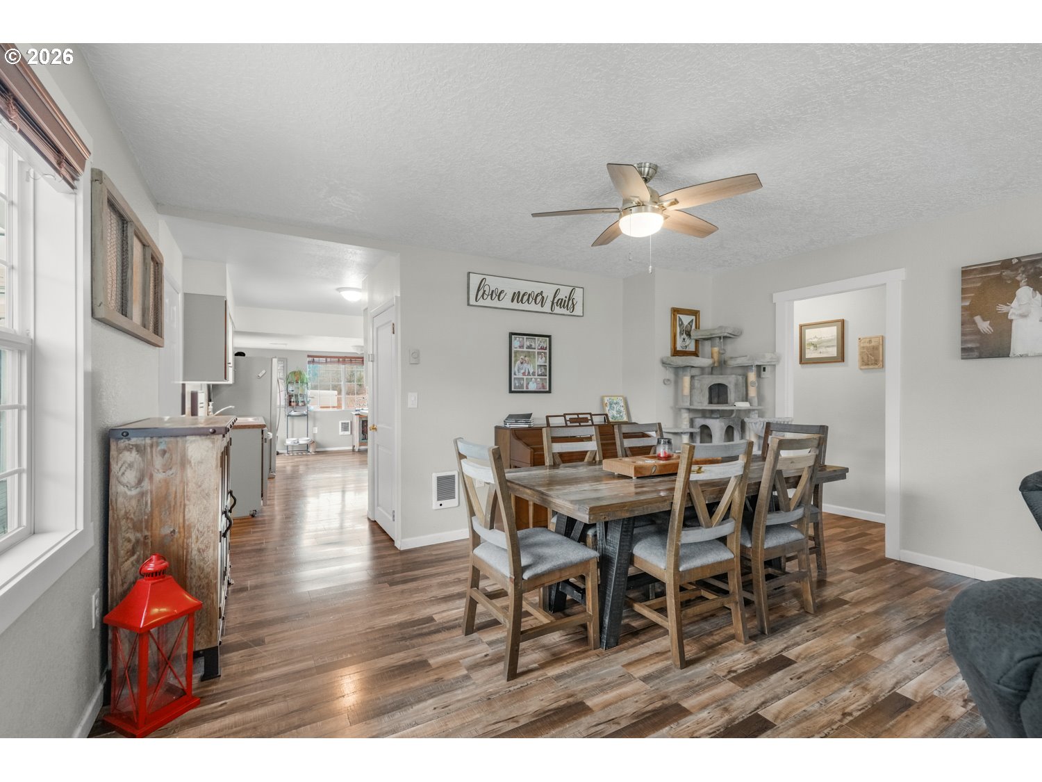156 Damron Road Mossyrock, WA 98564 - Photo 10 of 34 a view of a dining room with furniture and wooden floor