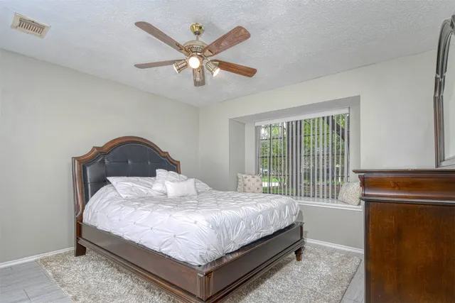 a bedroom with a bed and window