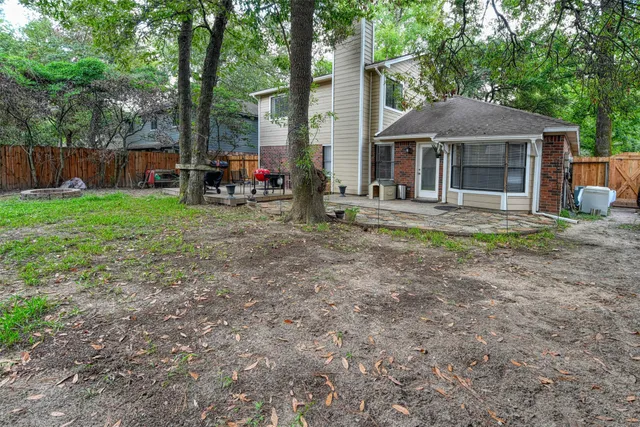 a view of a house with a yard and sitting area