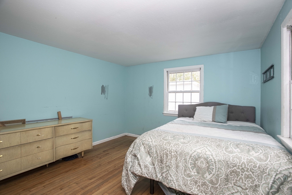 175 Summer Street Norwell, MA 02061 - Photo 14 of 29 a bedroom with a bed and a window