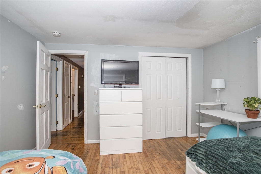 175 Summer Street Norwell, MA 02061 - Photo 16 of 29 a bedroom with a bed and flat screen tv