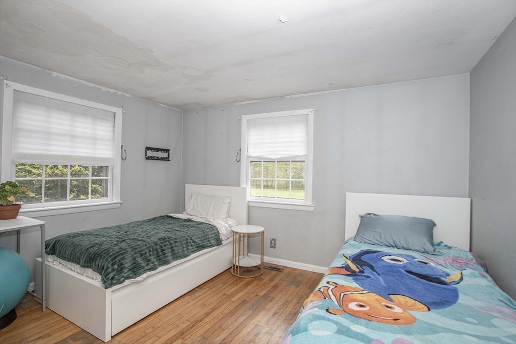 175 Summer Street Norwell, MA 02061 - Photo 17 of 29 a bedroom with a bed and a window