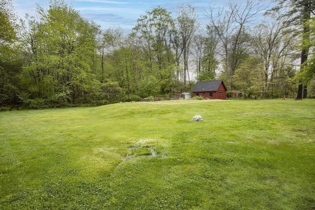 175 Summer Street Norwell, MA 02061 - Photo 27 of 29 a view of a field with trees in the background