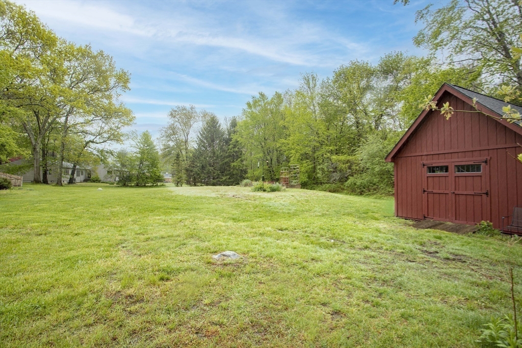 175 Summer Street Norwell, MA 02061 - Photo 28 of 29 a view of a backyard with large trees