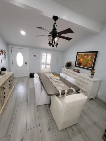 a large kitchen with stainless steel appliances kitchen island granite countertop a sink and cabinets