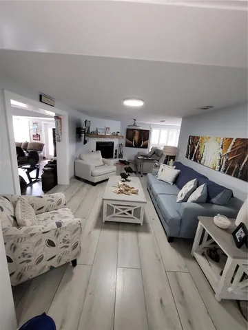 a bathroom with a granite countertop toilet and a sink