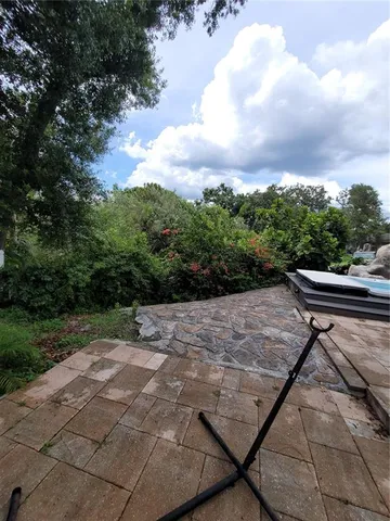 a view of a patio with chairs and a table