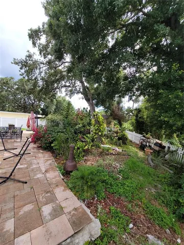 a spacious bathroom with a granite countertop sink a mirror and a