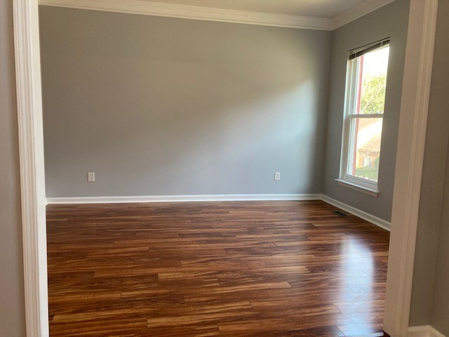 313 Compass Point Hermitage, TN 37076 - Photo 11 of 11 an empty room with wooden floor and windows with curtains
