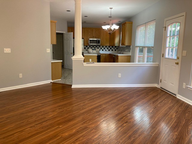 313 Compass Point Hermitage, TN 37076 - Photo 8 of 11 an empty room with wooden floor and windows