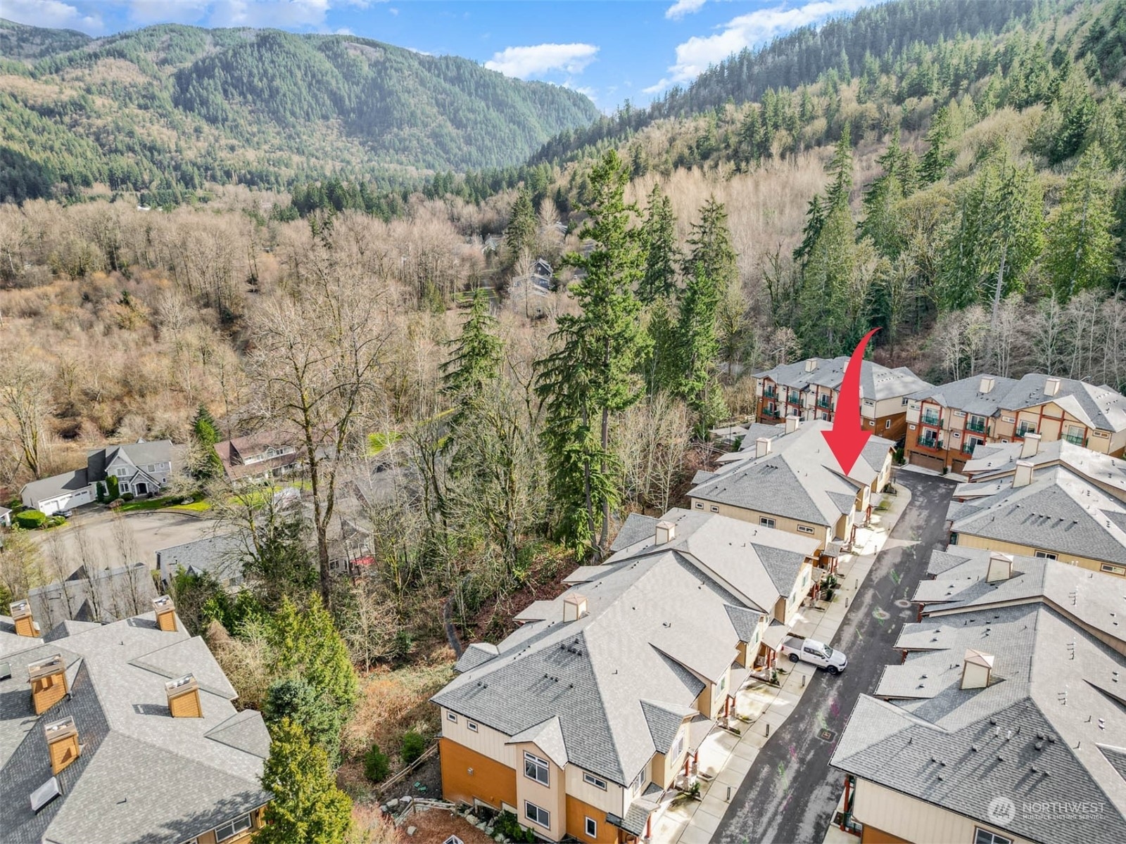 1074 Southwest Collier Place Issaquah, WA 98027 - Photo 31 of 36 an aerial view of a house with swimming pool and mountains