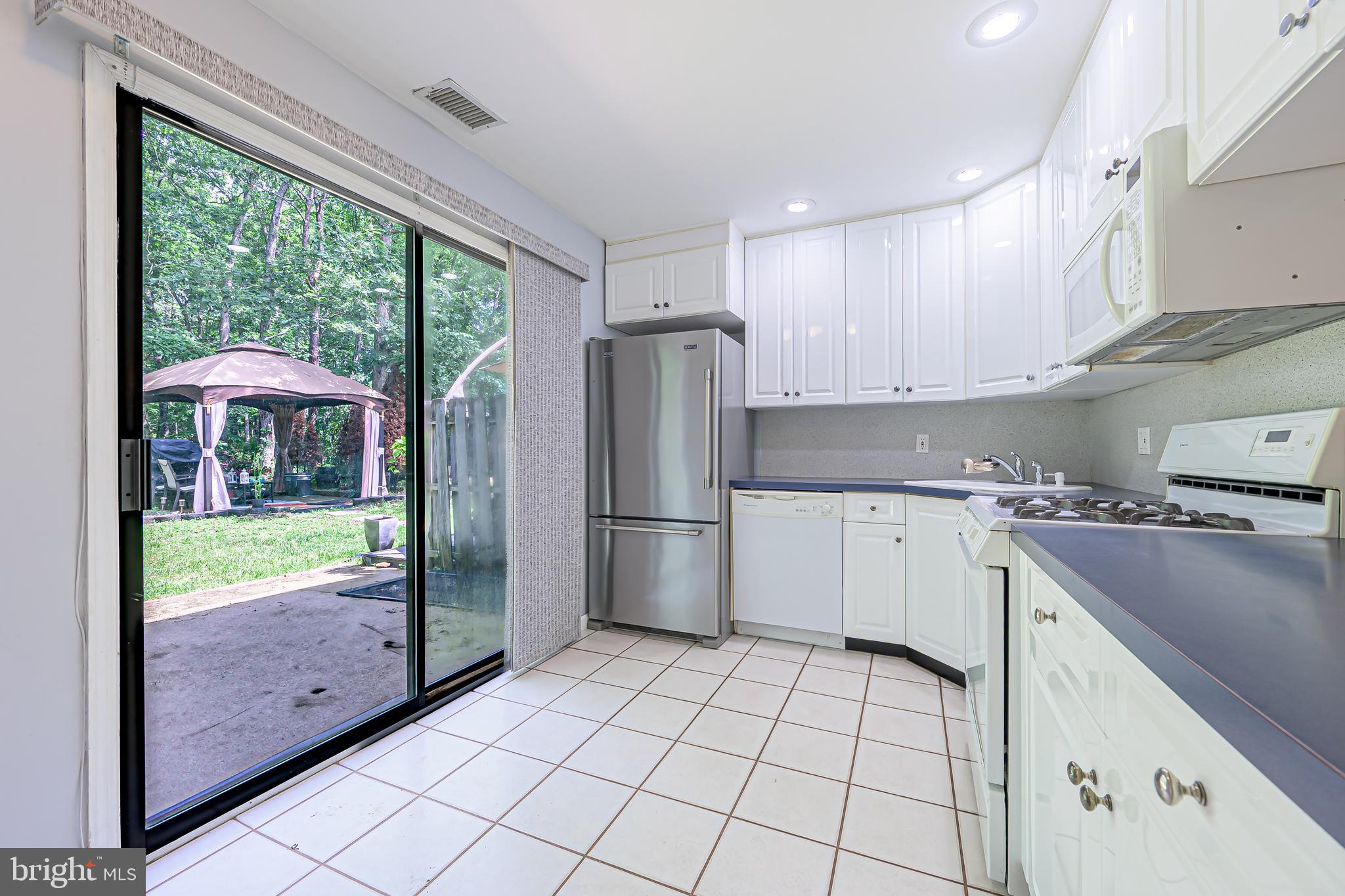 298 Mattix Run Galloway Township, NJ 08205 - Photo 11 of 36 a kitchen with stainless steel appliances granite countertop a refrigerator and a sink