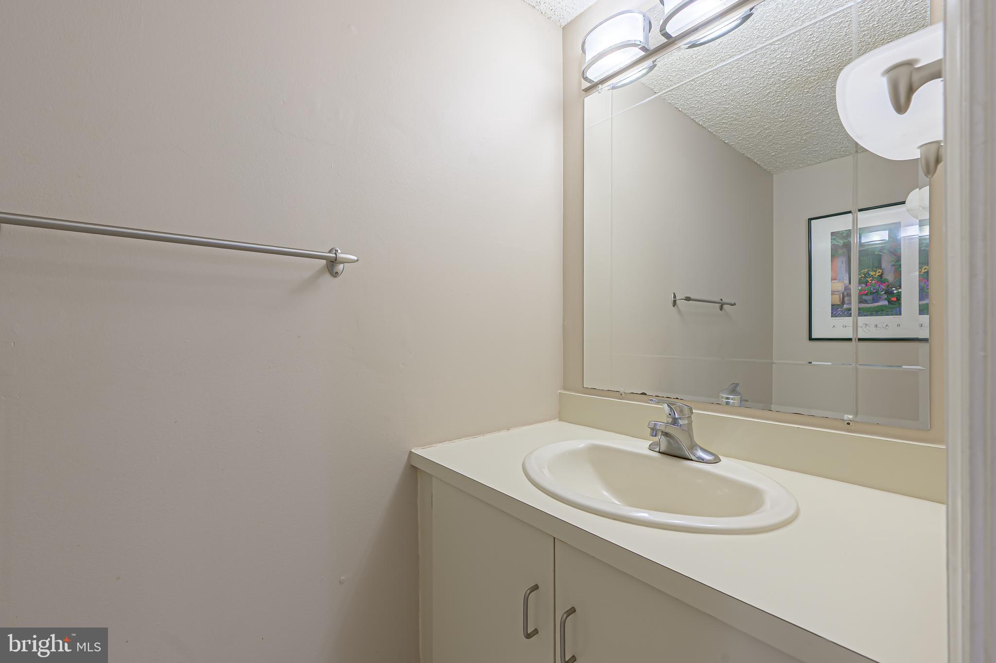 298 Mattix Run Galloway Township, NJ 08205 - Photo 15 of 36 a bathroom with a sink and a mirror