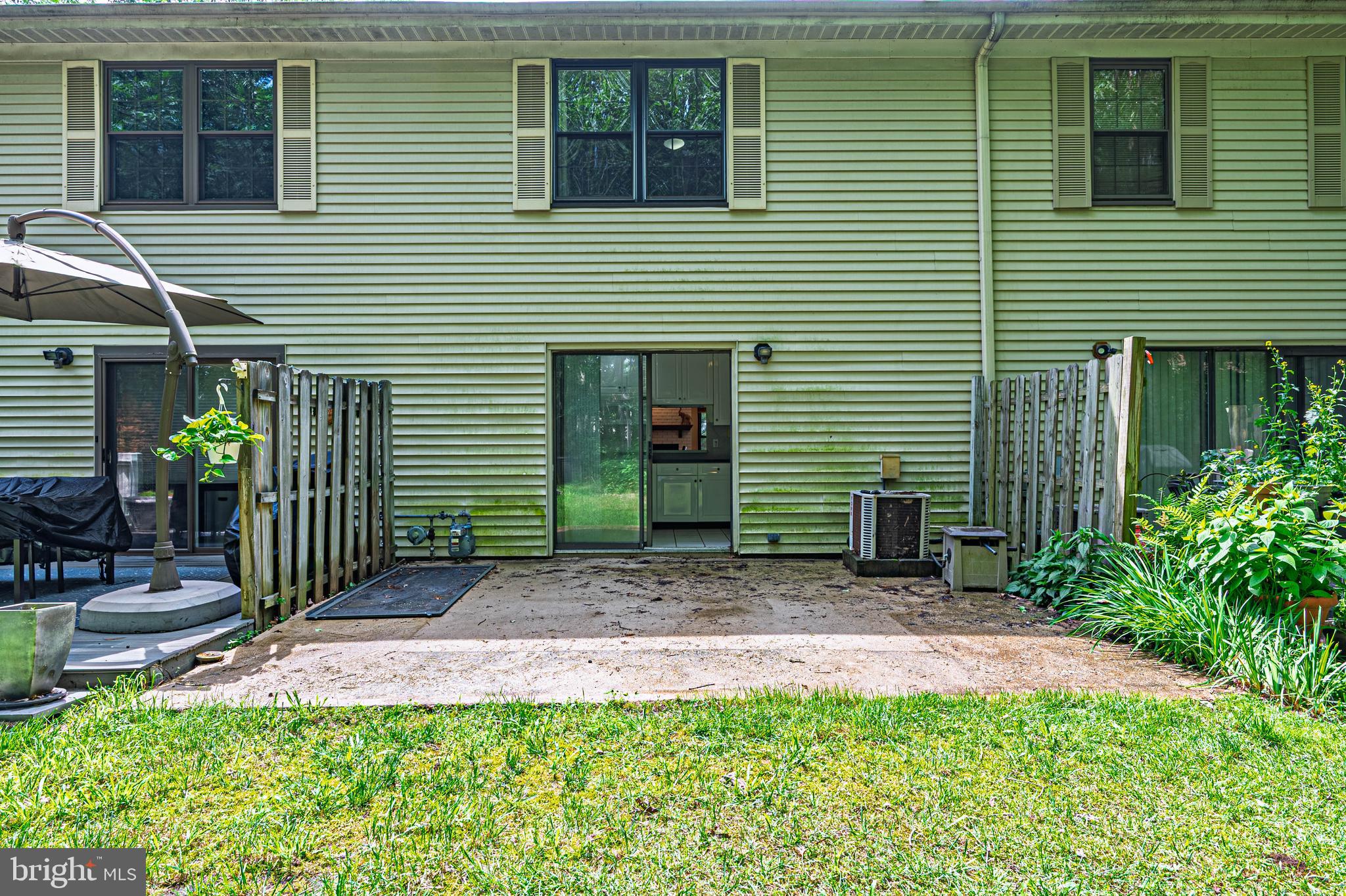 298 Mattix Run Galloway Township, NJ 08205 - Photo 23 of 36 a view of a house with brick walls and a yard with plants