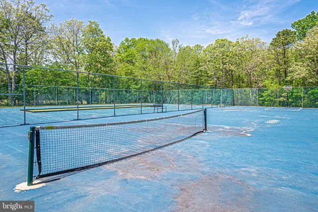 a view of street with houses and trees