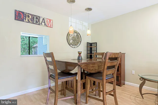 a view of a dining room with furniture and a table