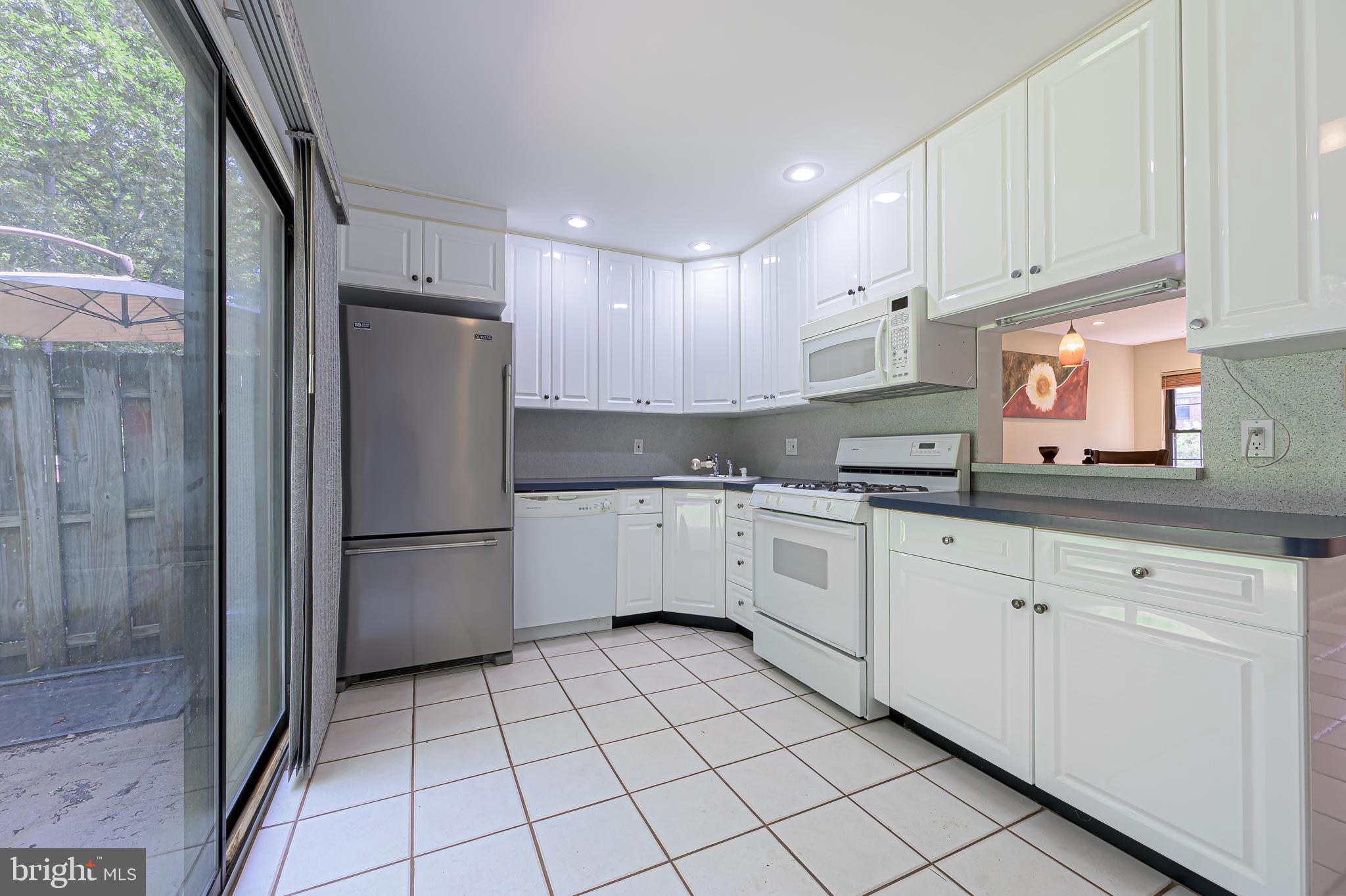 298 Mattix Run Galloway Township, NJ 08205 - Photo 10 of 36 a kitchen with white cabinets white appliances and sink