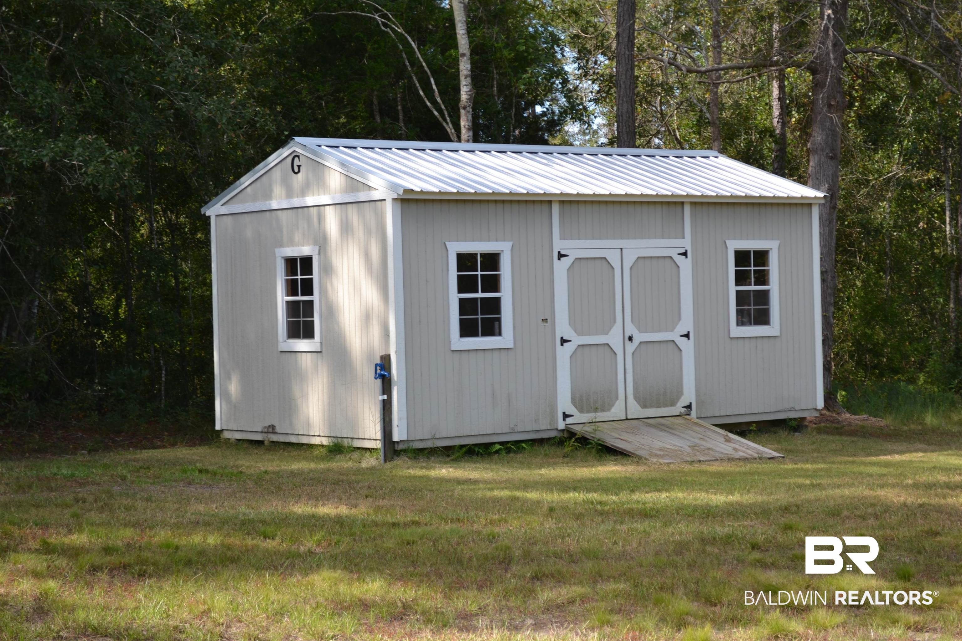9941 Pelican Bend Elberta, AL 36530 - Photo 28 of 30 Empty shed conveys