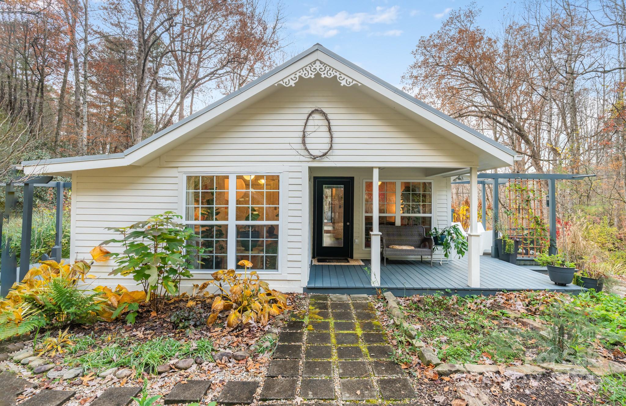 200 Nimitz Drive Brevard, NC 28712 - Photo 1 of 44 a front view of a house with garden