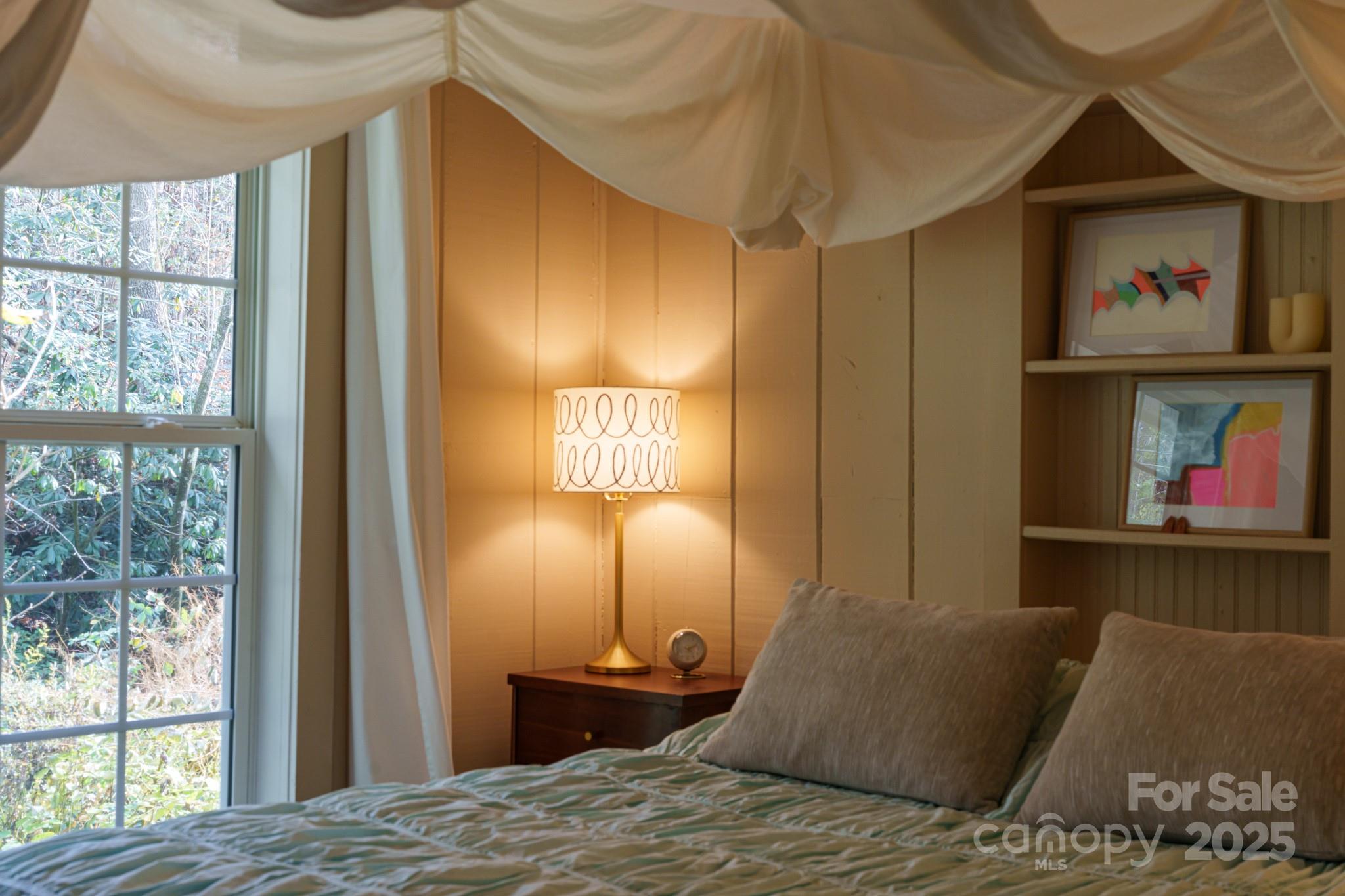200 Nimitz Drive Brevard, NC 28712 - Photo 20 of 44 a bedroom with a bed and a painting on the wall