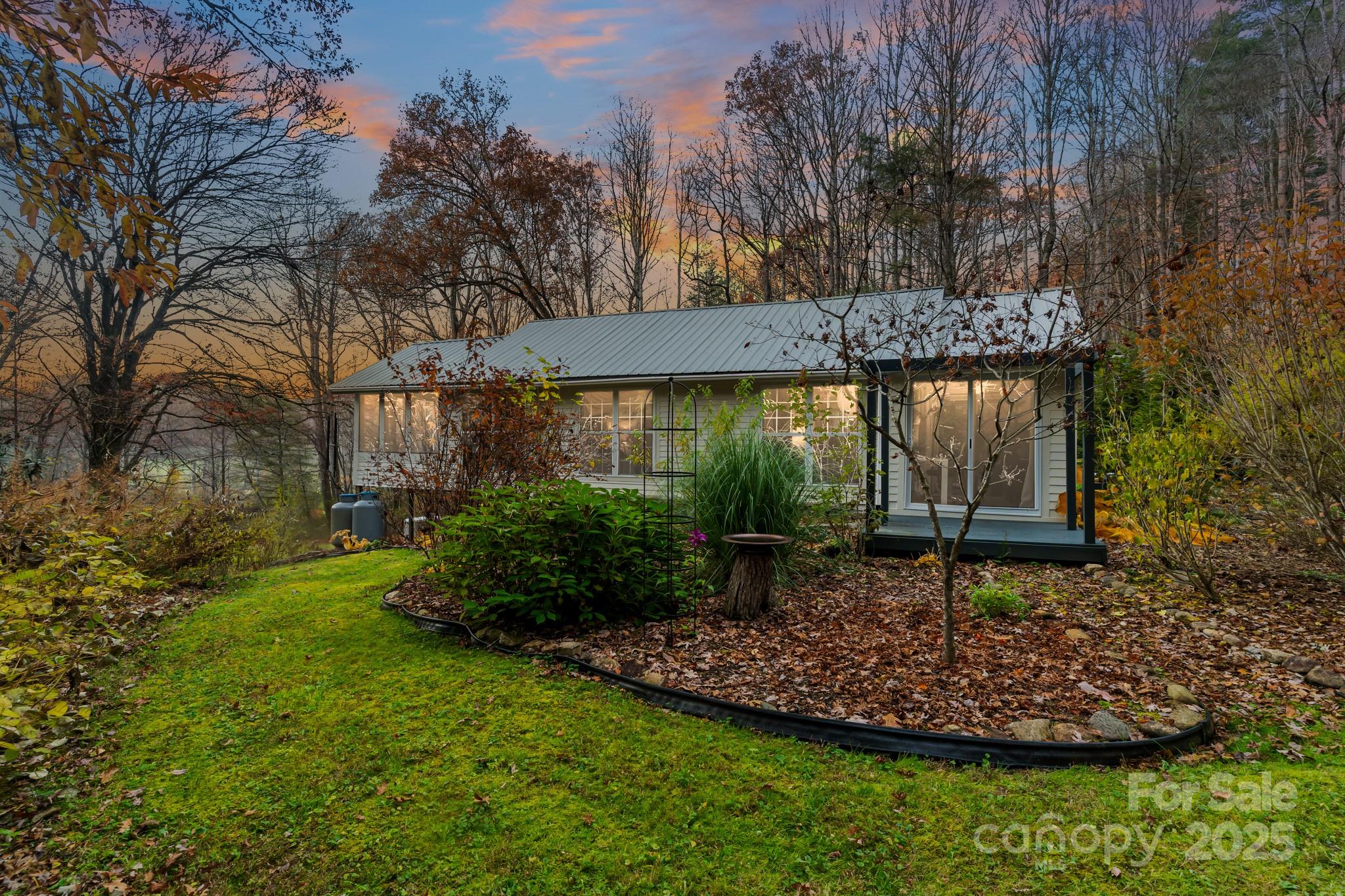 200 Nimitz Drive Brevard, NC 28712 - Photo 39 of 44 a view of a backyard with plants and large trees