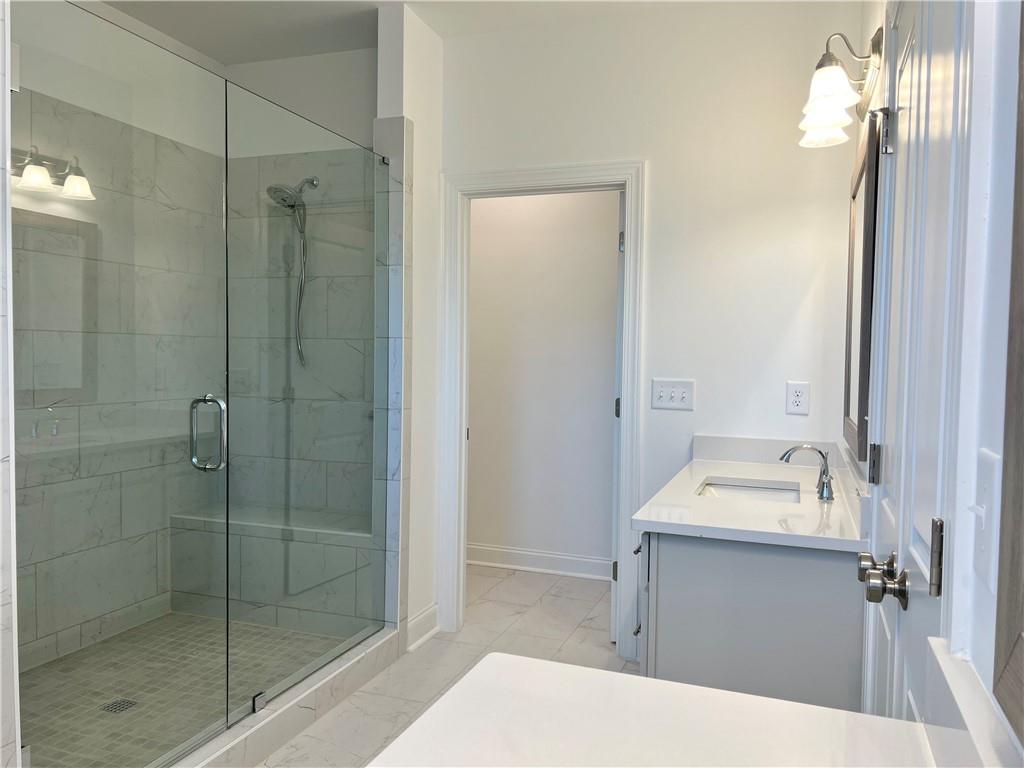 3347 Goodwin Park Suwanee, GA 30024 - Photo 14 of 28 a bathroom with a sink a toilet and shower