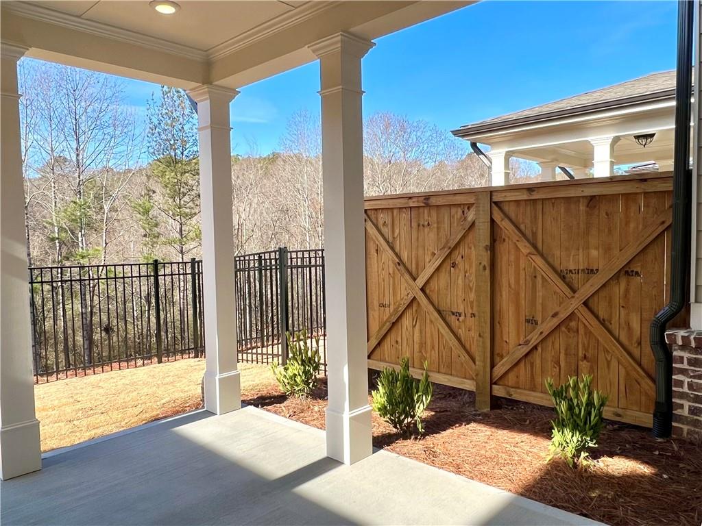 3347 Goodwin Park Suwanee, GA 30024 - Photo 22 of 28 a view of a balcony with a floor to ceiling window and wooden floor