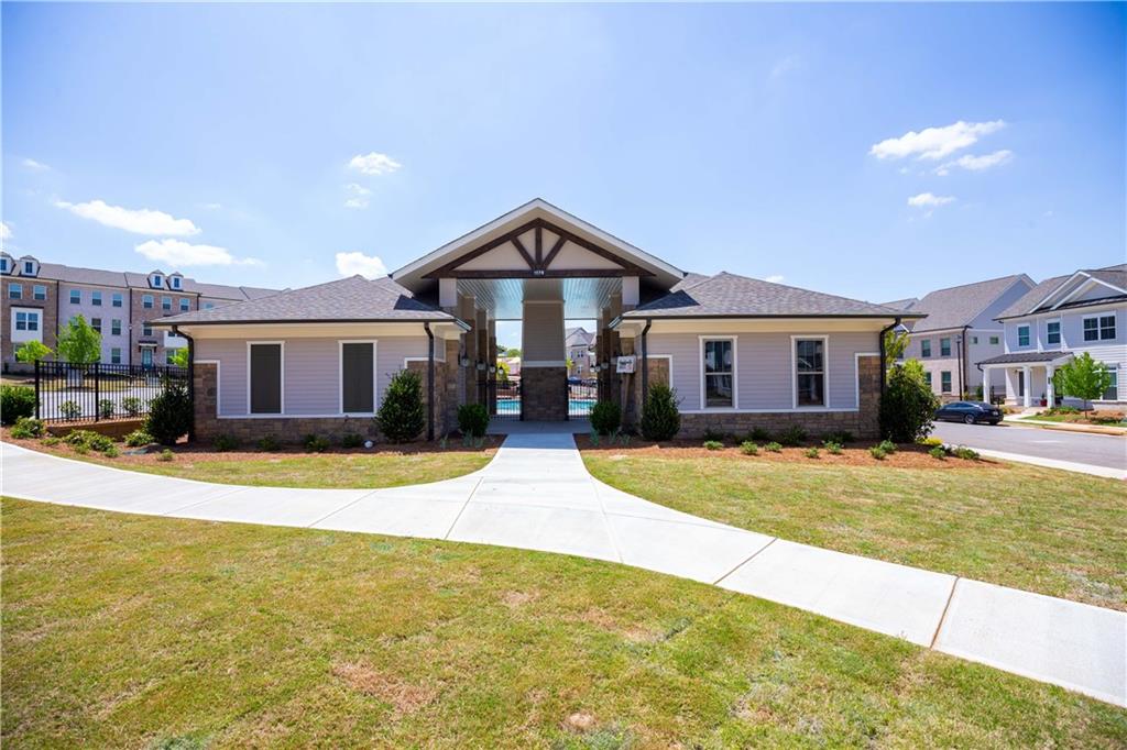 3347 Goodwin Park Suwanee, GA 30024 - Photo 25 of 28 a front view of a house with a yard and garage