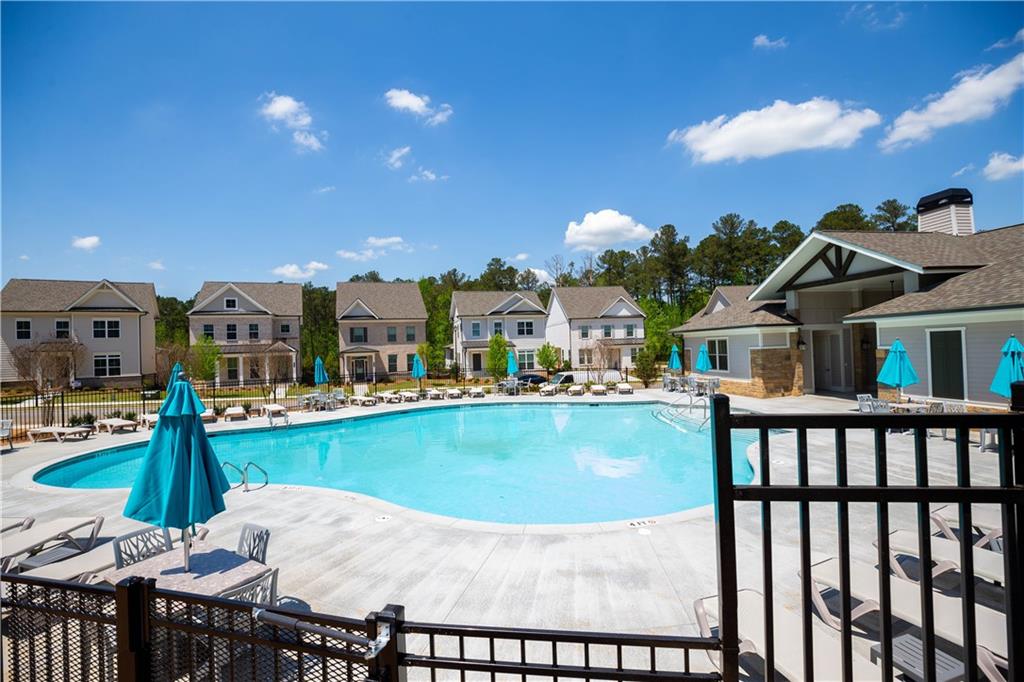 3347 Goodwin Park Suwanee, GA 30024 - Photo 28 of 28 a view of a house with swimming pool and sitting area