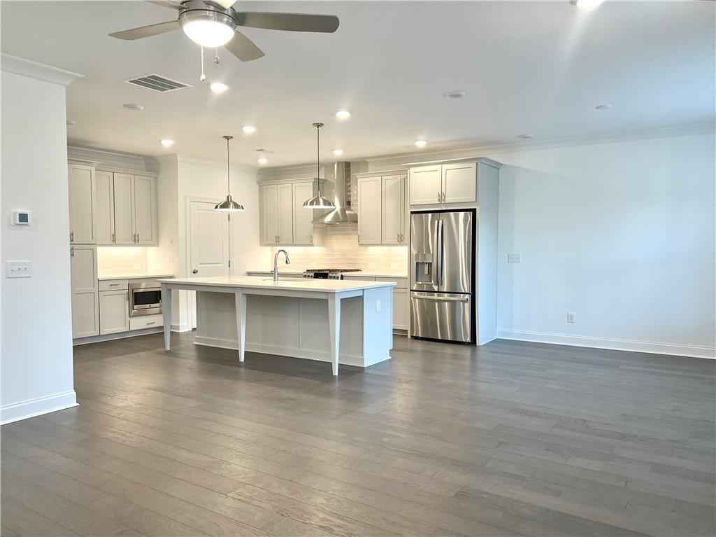 3347 Goodwin Park Suwanee, GA 30024 - Photo 6 of 28 a view of kitchen with stainless steel appliances refrigerator oven microwave and cabinets