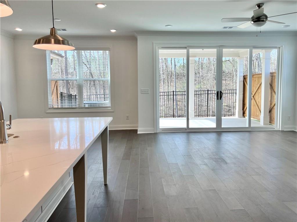 3347 Goodwin Park Suwanee, GA 30024 - Photo 9 of 28 a view of an empty room with wooden floor and a window