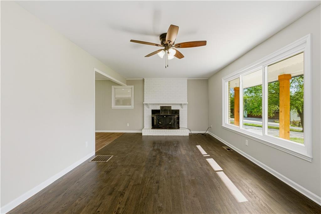 5605 Burke Lane Gainesville, GA 30506 - Photo 19 of 62 a view of a livingroom with a window and a ceiling fan