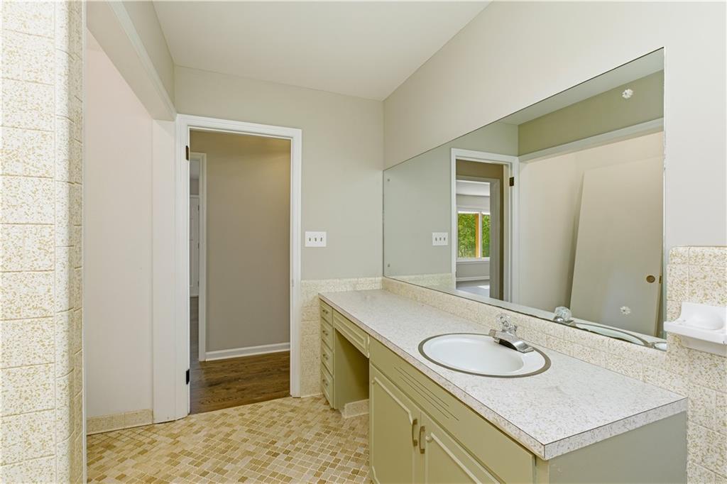 5605 Burke Lane Gainesville, GA 30506 - Photo 35 of 62 a bathroom with a sink and a mirror