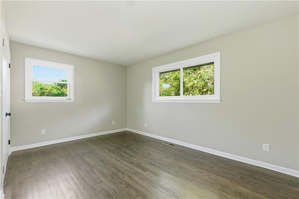 5605 Burke Lane Gainesville, GA 30506 - Photo 42 of 62 an empty room with wooden floor and windows