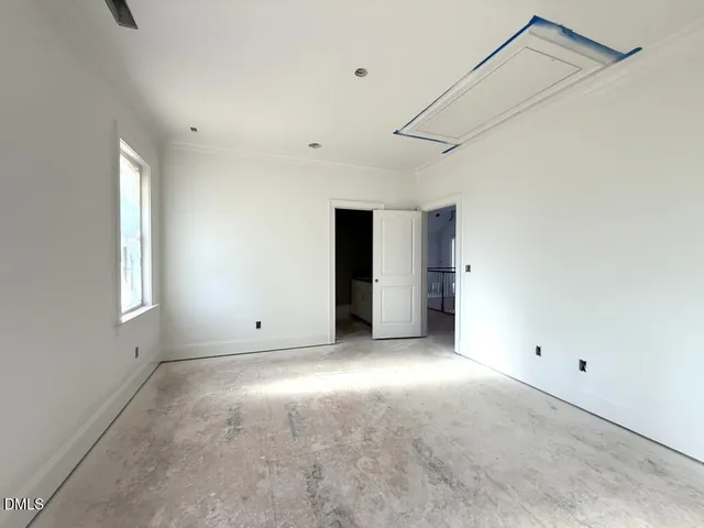 a view of empty room with windows