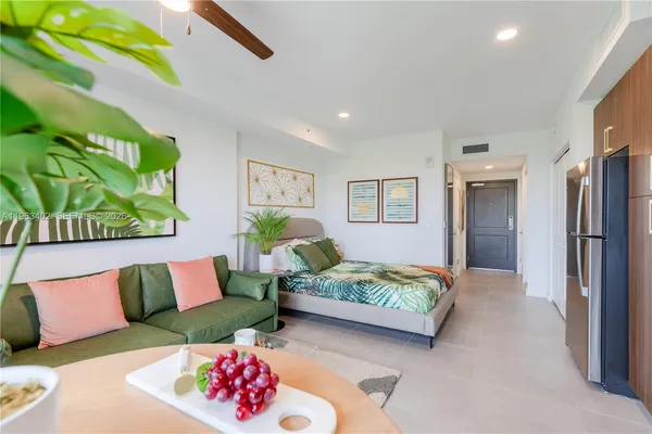 a bedroom with a bed and a couch
